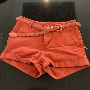 Small orange shorts with belt